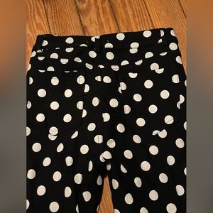 Black polka dot ruffle bottom skin tight pants